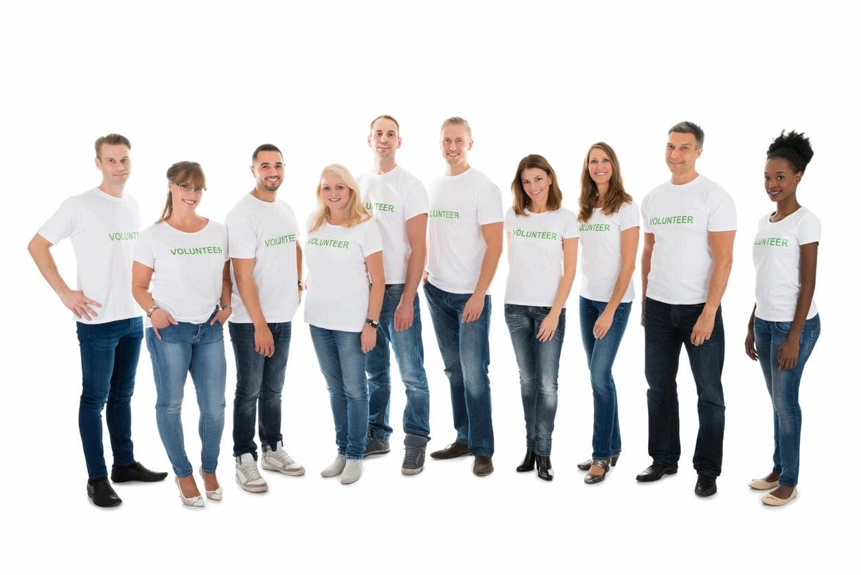 A group of people wearing white shirts and jeans.
