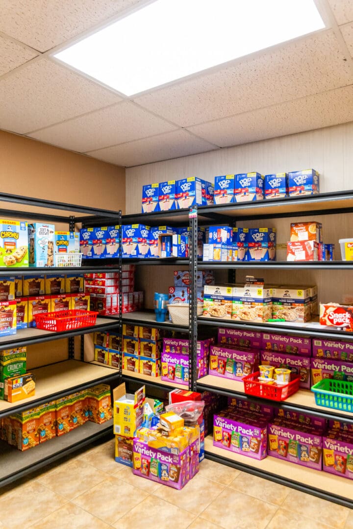 A room filled with shelves of food and drinks.