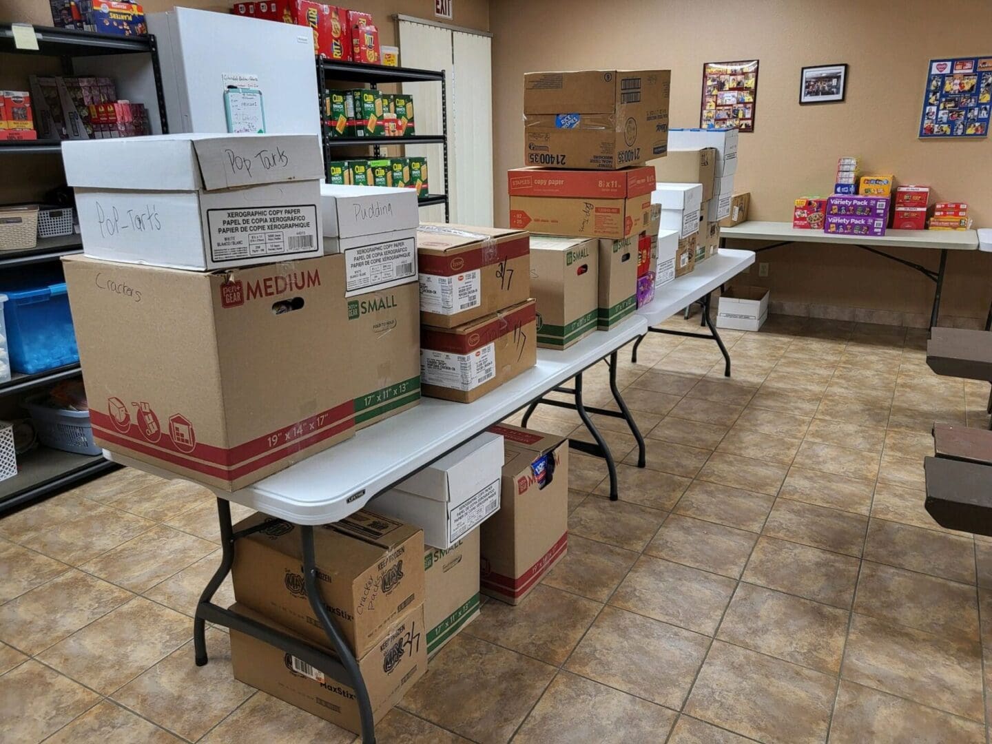 Peoria Traditional food drive 24 boxes on table