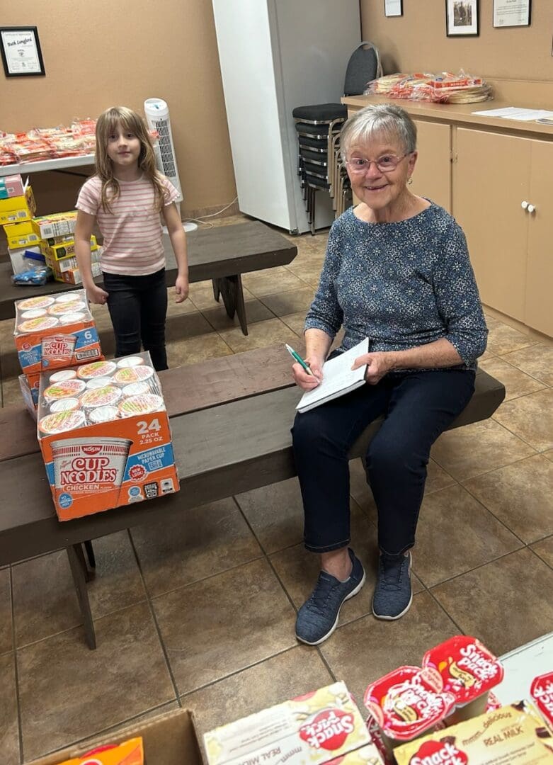 Volunteers packing food at community pantry