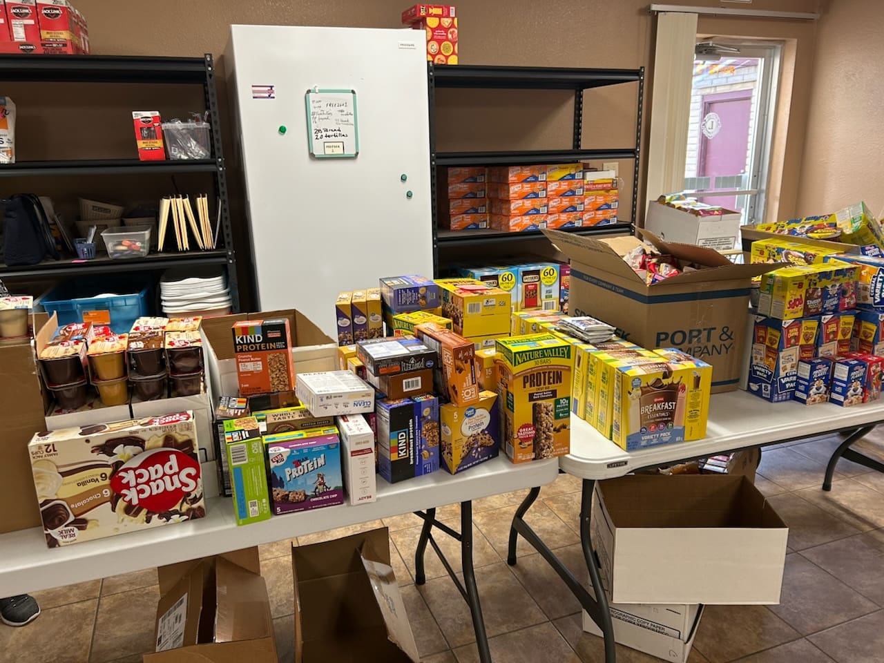 Assorted boxed snacks on folding table