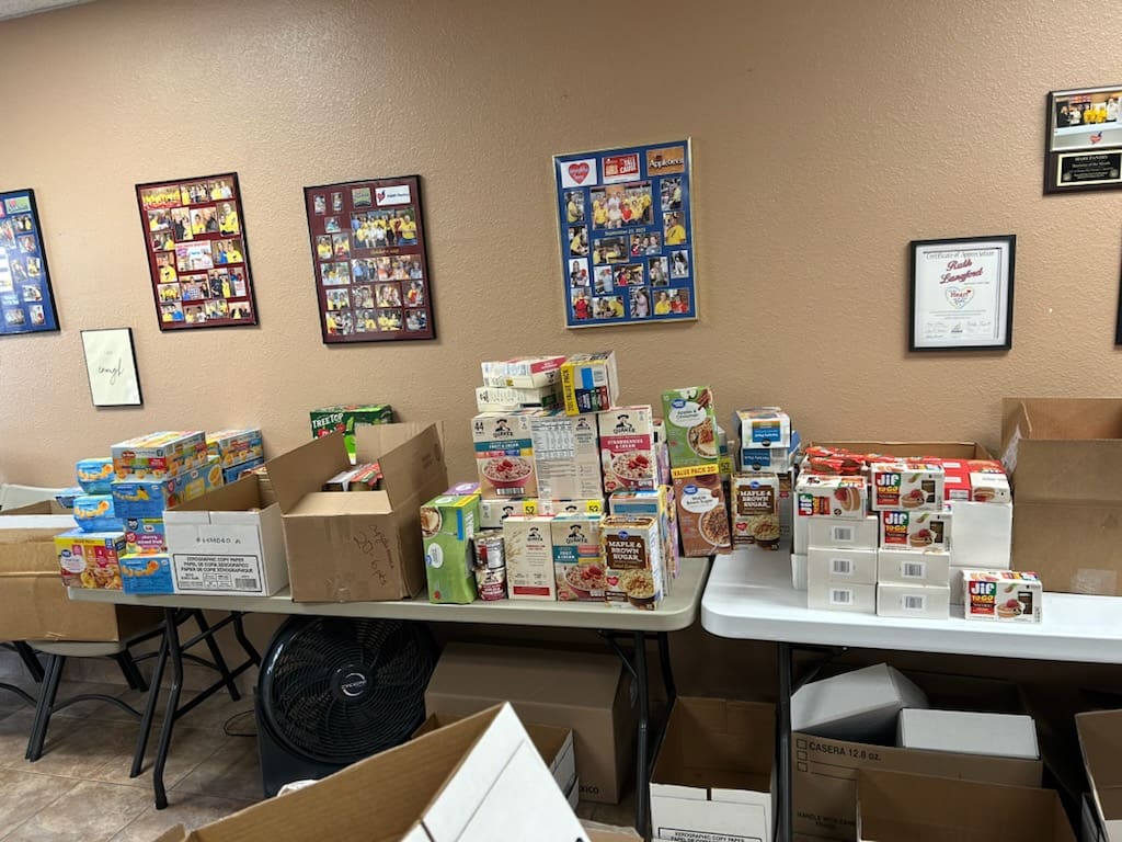 Assorted boxed food donations on tables