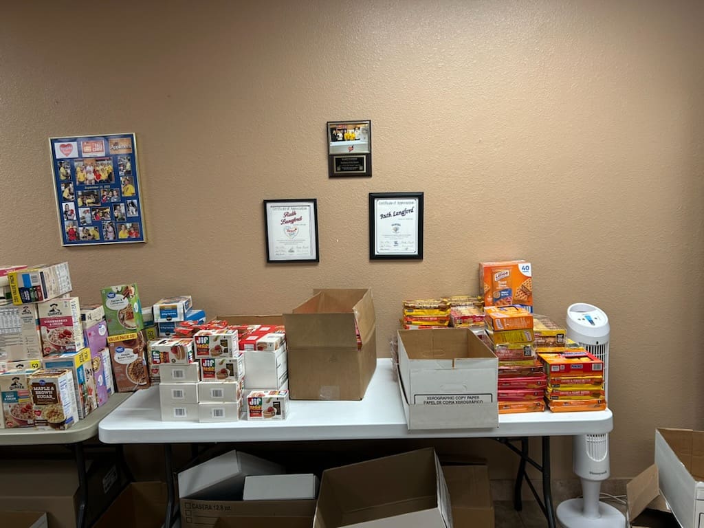 Community pantry table with boxed food